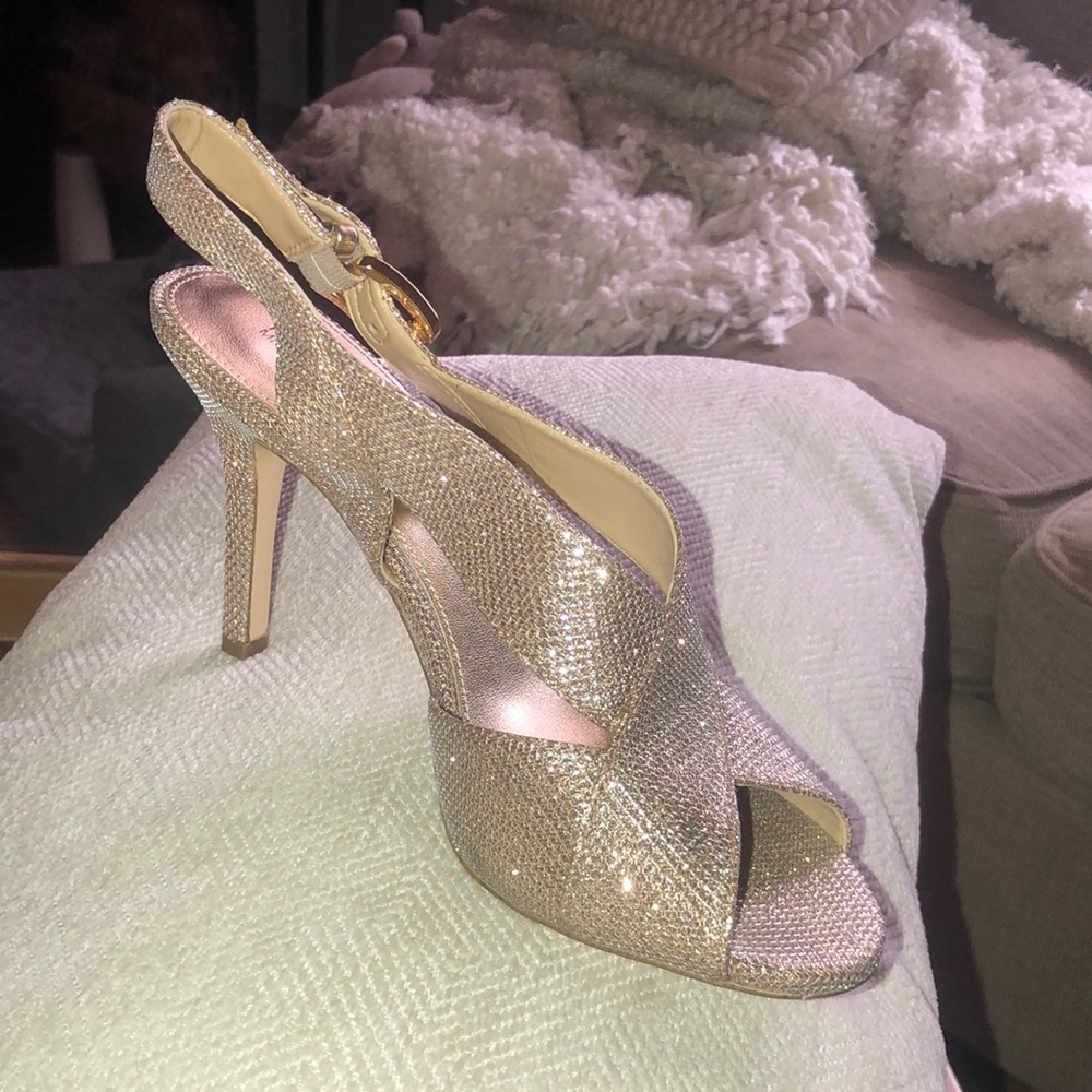Michael Kors gold open toe heal. Worn once or twice. Good shape. Size 8